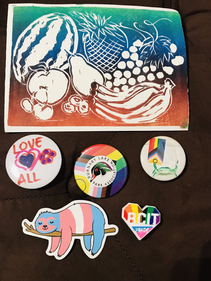 Pride buttons, BCIT heart shaped pin, block print with paint