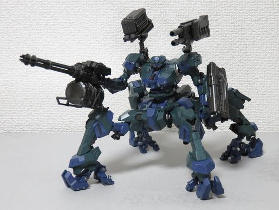 A quadrupedal robot from the game "Armored Core 6".
The body is painted chrome green and indigo blue.
The machine holds a Gatling gun on the right hand.