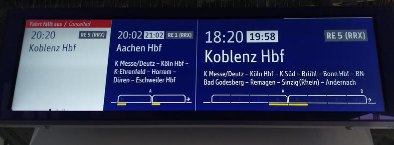 Picture of an electronic announcer showing one delay from 18:20 to 19:58, one from 20:02 to 21:02, and one cancellation of the 20:20 train.