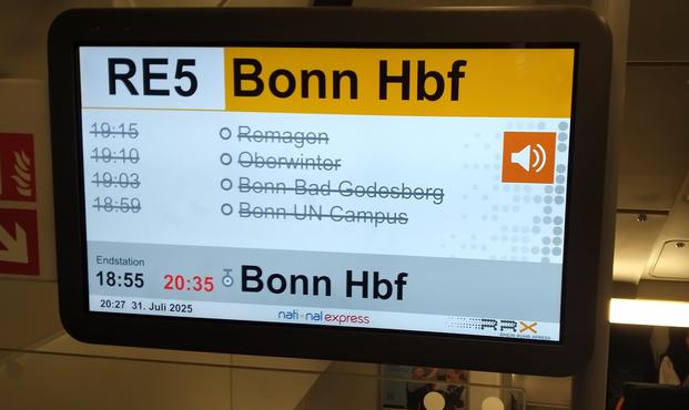 Picture of an electronic display showing that the 18:55 train is arriving 20:35 and all stops after Bonn Hbf are canceled.
