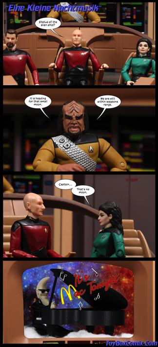 Location: Enterprise-D bridge
Panel 1: Star Trek: TNG-style title: “Eine Kleine Nachtmusik.” Picard: “Status of the alien ship?”
2: Worf: “It’s heading for that small moon. We are still within weapons range.”
3: Troi: “Captain…That’s no moon.”
4: On the screen is a humanoid with a moon-shaped head and sunglasses sitting at a grand piano. Music hangs in the air: “It’s Mac Tonight!”