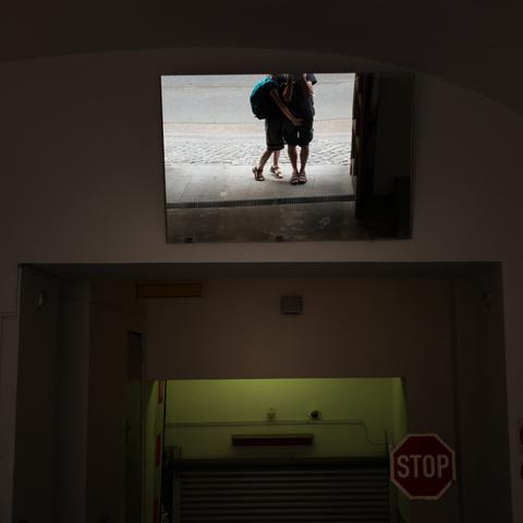 Photo of the photographer making a selfie in a mirror, with his girlfriend placing her hand on his crotch