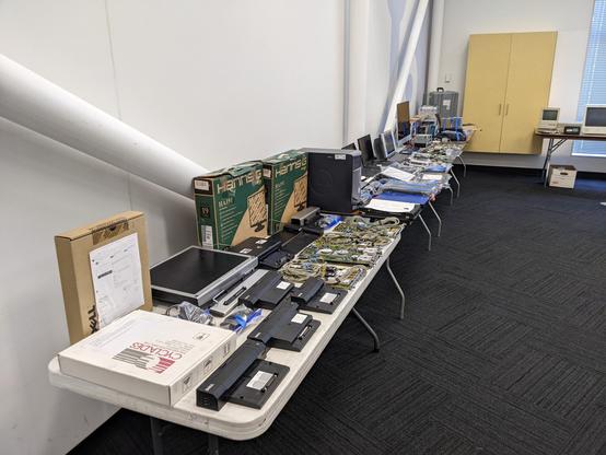 Three tables full of retro computing gear