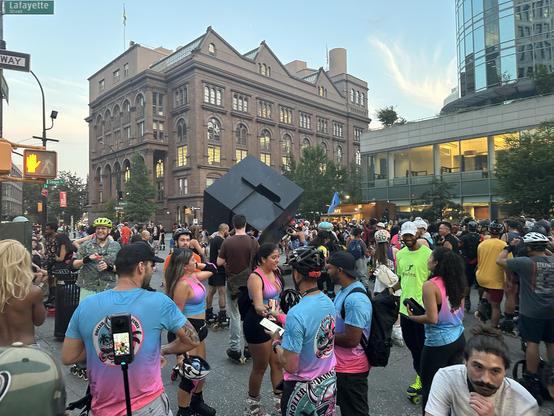 Photo of many inline skaters takking a rext break at the Alamo, i.e., Astor Place.