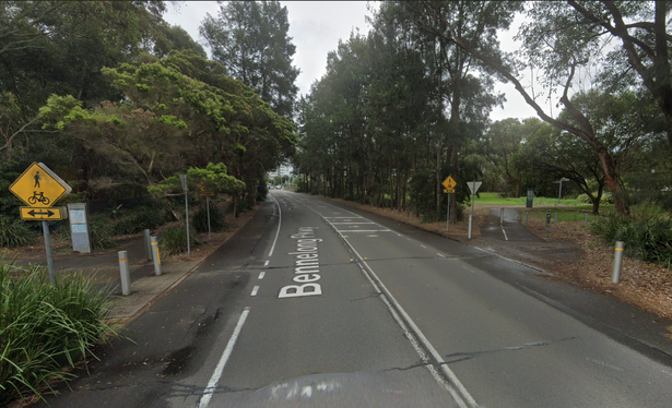 Screenshot from Google Streetview showing the spot on the Bennelong Parkway road where the Parkand Circuit shared used path just ends at the side of the road, and another shared use path starts on the other side. There is no pedestrian crossing linking the two, and no footpath next to the road that could be used to go somewhere else to cross.