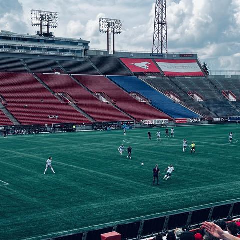Women Footballers (Soccer) playing at McMahon Stadium, Calgary AB. 

White jerseys are AFC Toronto, Purple jerseys are Calgary Wild FC.