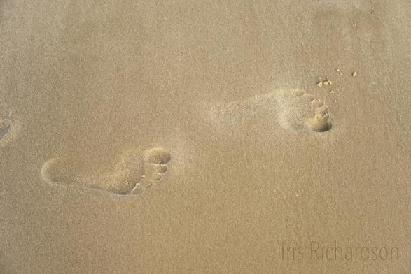 Footprints in sand photograph