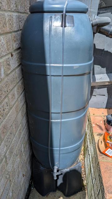 Step 3: run exterior section of pipe down outside of the butt, round tap and back up again so end is above the max water line. Secure end of pipe to butt with gorilla tape