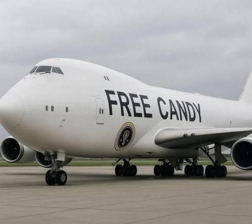 A picture of a presidential plane with the words, "FREE CANDY" painted on the side.