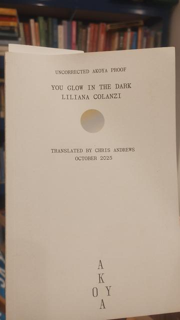 A plain, white advance proof copy of You Glow in the Dark by Liliana Colanzi