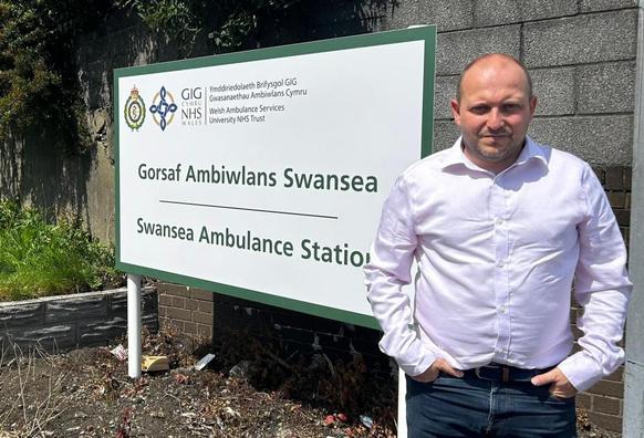 Cllr Sam Bennett outside Swansea Ambulance Station