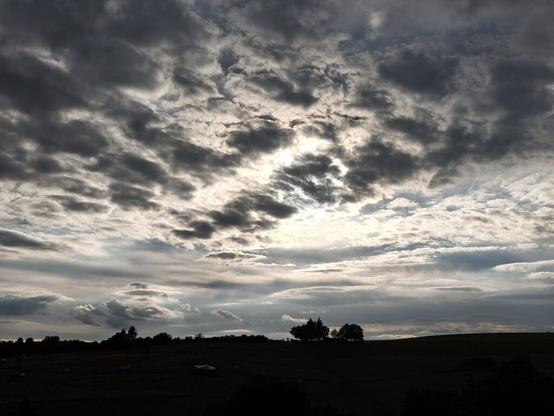 typical sky over cabin in the woods with clouds