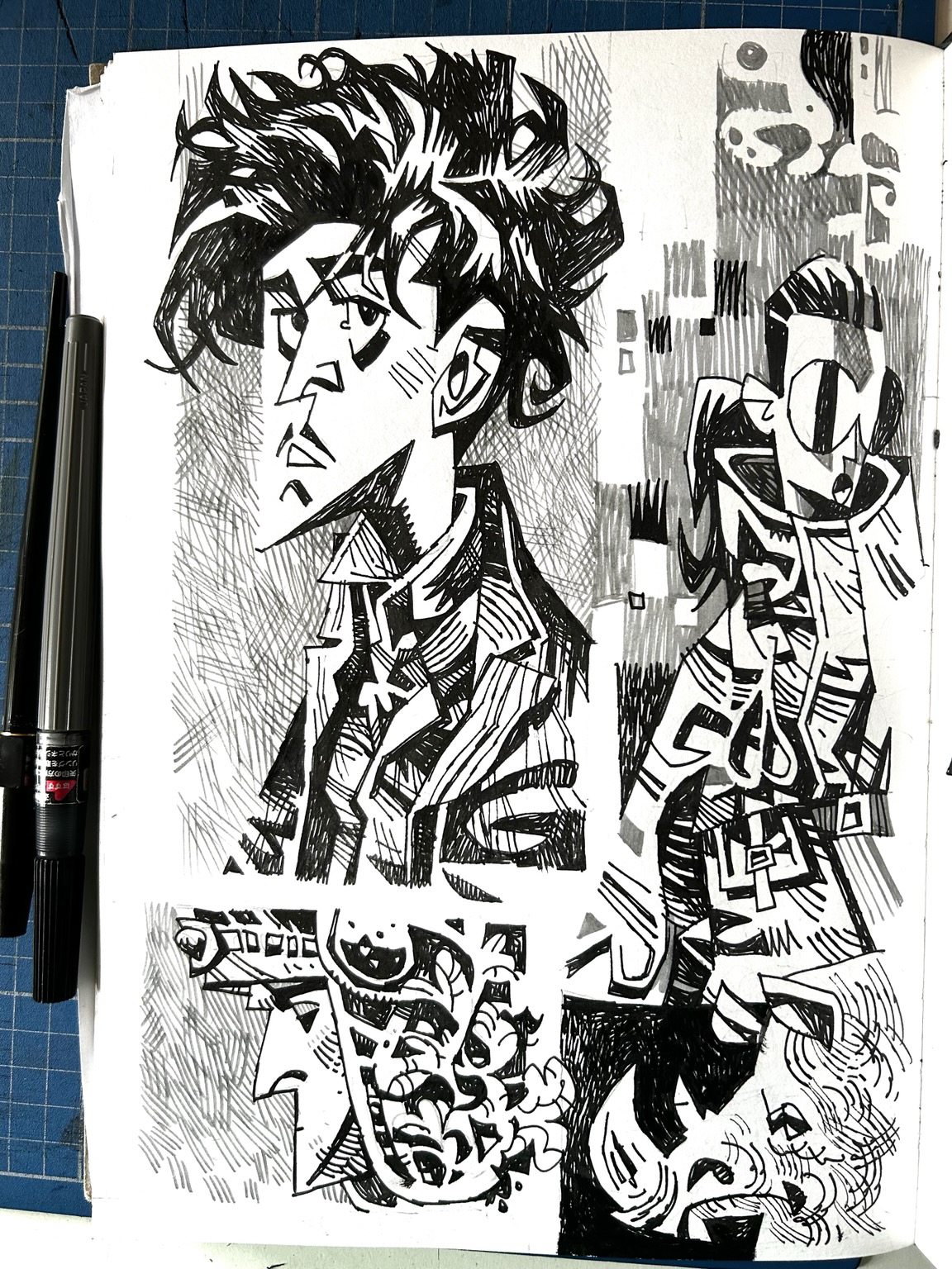 A selection of black and white drawings in a sketchbook