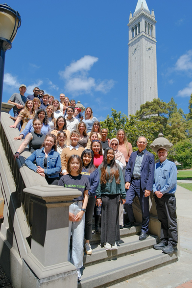 This photo shows a group photo of all participants of the summer school on the stairs of South Hall.