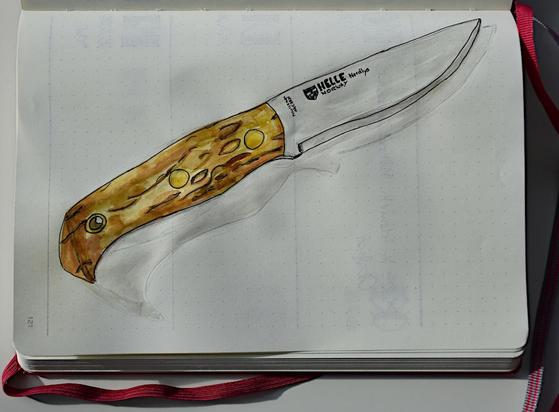 The knife alone on the page.