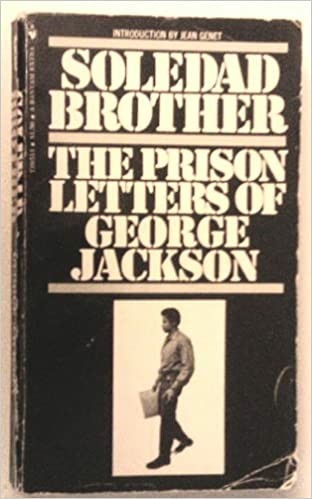 Book cover of "Soledad Brother: the prison letters of George Jackson." Black background. white lettering. Photo of George jackson walking.
