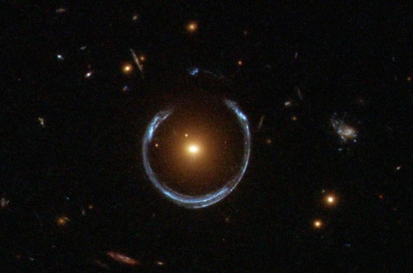 Gravitational lensing by a distant black hole of immense size