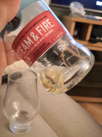 Photo of an almost empty bottle of whisky