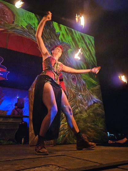 Chapter 1 — Baptism by Flame

🔥 The music thumped, the air was electric, and my heart was trying to escape my chest.
Four strangers, four sets of flames, one shared rhythm.

It was my first official fire performance — nerves gnawed at me right up until the moment my boots touched that stage. Then the fire took over. My hands moved before my mind could catch up. Time blurred. The crowd disappeared. All I could feel was the heat, the movement, and this wild, perfect flow between us.

When the last beat faded, I didn’t want to leave. The stage felt like home.
This was Perth. This was a psytrance festival. This was the night I learned the fire dances through you, not for you.

#FireFlow #FlowArts #Psytrance #FireDancing #MalikasRealm