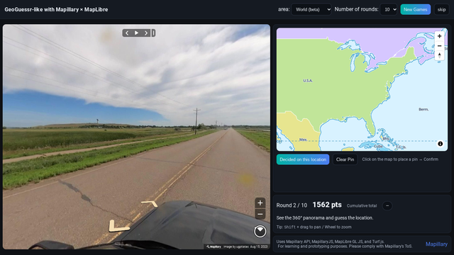 screenshot of MapiGuesser, featuring a street view country scene and map of the United States
