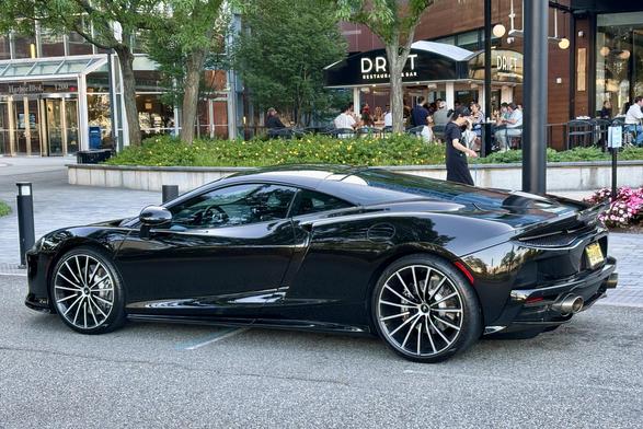 A black McLaren, side view.
