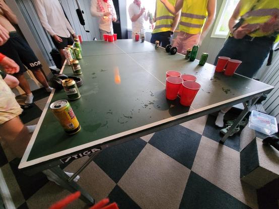 People playing beer pong