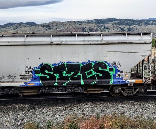 Train car with graffiti rolling through Kamloops BC Canada