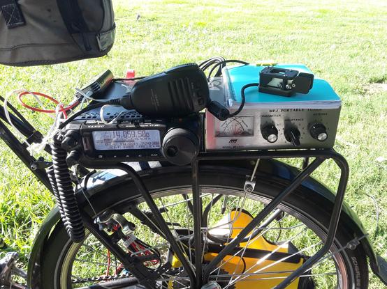 Yaesu FT-891 Ham Radio Transceiver and MFJ 971 Antenna Tuner mounted on a bicycle rear rack for portable operating