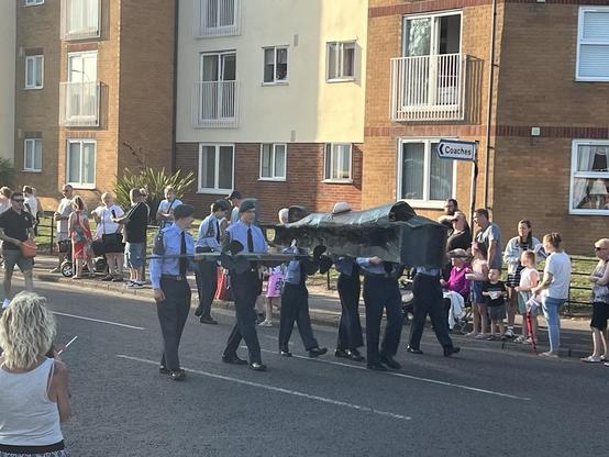Cardboard aircraft shouldered by aircadets