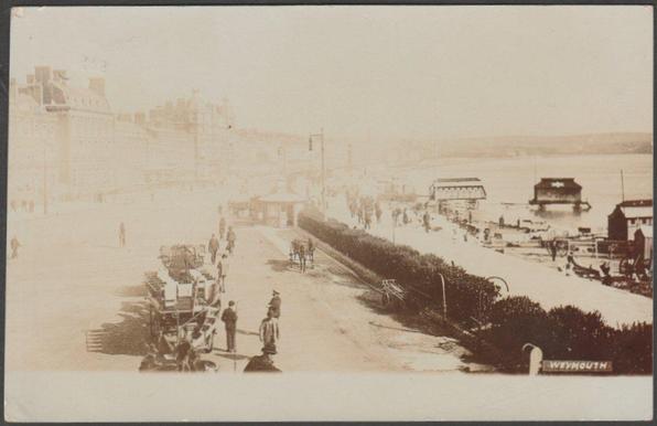 Sepia real photographic postcard showing a view of The Esplanade at Weymouth in Dorset.

Cummings Series, Weymouth, not numbered.

Postally used on 9 May 1905 with double circle Exeter cancellation on green halfpenny stamp and sent to Mrs A. Bennett, Luxulyan, near Lostwithiel, Cornwall.

Very good condition, with very slight corner bumps, but slight bumps to both left corners and some fading to left side.