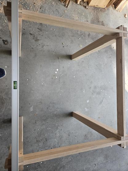 table dry fitted with a level across the front legs showing it is level.