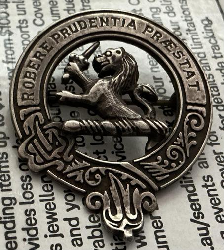 After less than a minute wiping it with a silver cloth the badge started to brighten & show the silver under all the muck.