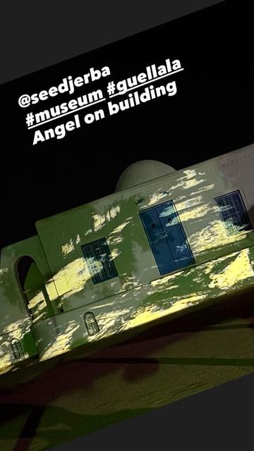 Video with abstract structures on small white building @seedjerba #museum #guellala Angel on building