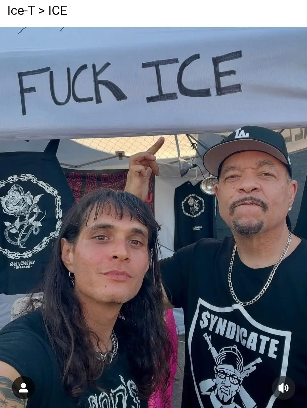 Ice T himself posing for the sign that reads Fuck ICE