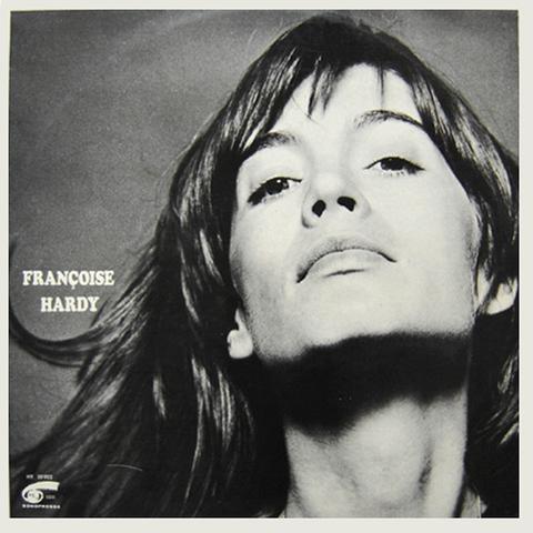 The cover art is a black and white photo of the artist from the neck up, looking at the camera with her chin tilted upwards, long hair flowing. Her name is written in white font on the left side.