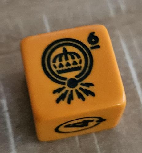 The 6 face of the orange D6. This face has a double circle and some icon within.