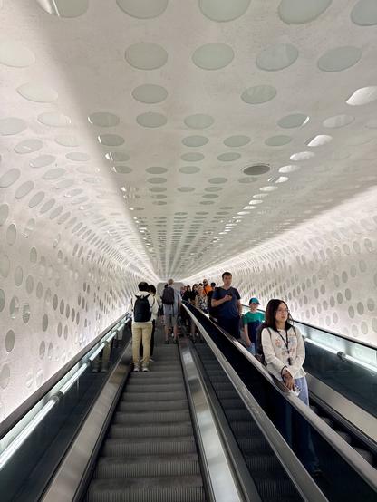 Going up the escalator through a bent shaft.