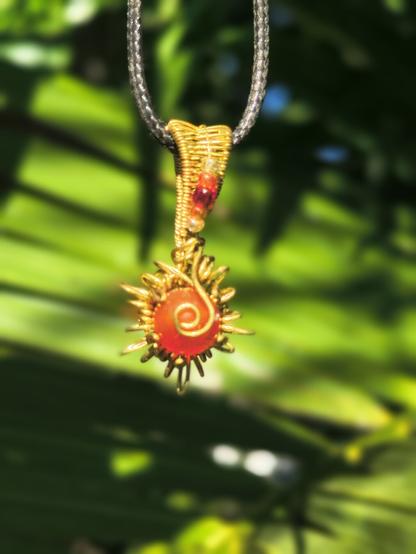 Chapter 5 — First In, Best Dressed

☀️ Some pieces barely get a chance to see the light before they find their person.

This little sun didn’t linger — as soon as I posted it in my story, the messages started rolling in. Friends claiming it with a smile, a wink, a “dibs!”
First in, best served. 😉

Now it hangs around someone’s neck, catching glints of real sunlight, carrying that spark of instant connection.

#WireWrapping #HandmadeJewelry #SunPendant #MalikasRealm