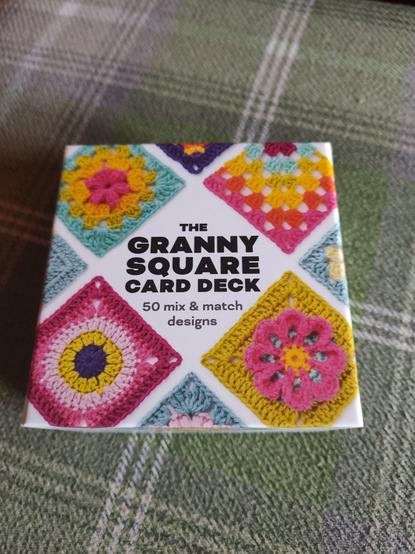 A colourful box with crochet granny squares on the lid. It says "The Granny Square Card Deck. 50 mix and match designs"