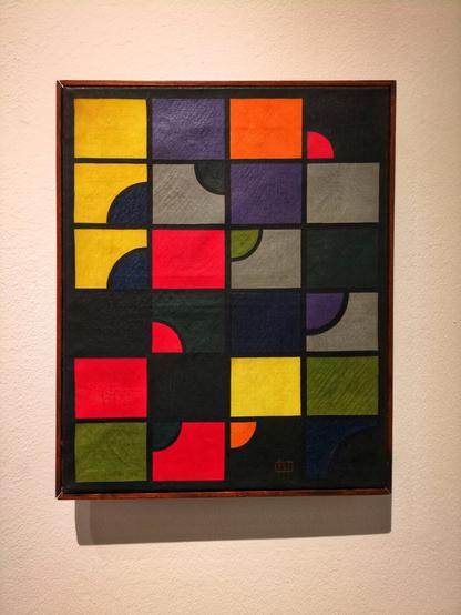 One of the first fully geometric abstract paintings by Cesar Domela. It features a 4x6 grid of squares with black outlines, some with different coloured semicircles cut out of them. The squares and semicircles are either black, or in highly saturated yellows, oranges, greens, purples, or greys. De Stijl movement, including Rietveld, were heavily influenced by modernist painters like Domela.