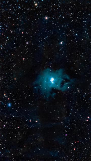 A starry night sky filled with numerous stars, with a prominent blue nebula or gas cloud in the center, surrounded by various celestial objects.

Gwiaździste nocne niebo wypełnione licznymi gwiazdami, z widoczną niebieską mgławicą lub chmurą gazu w centrum, otoczoną różnymi obiektami niebieskimi.