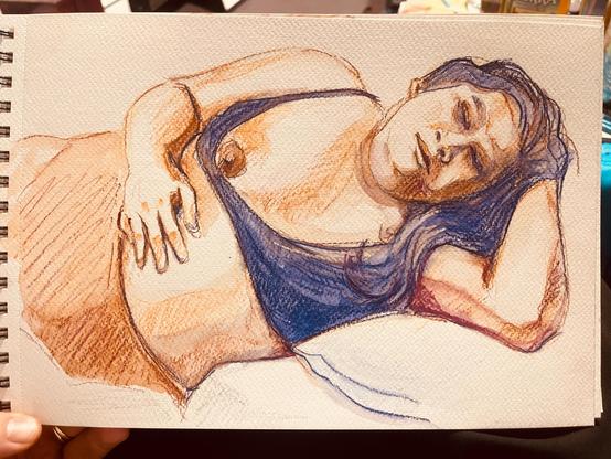 A watercolor pencil drawing of a reclining figure