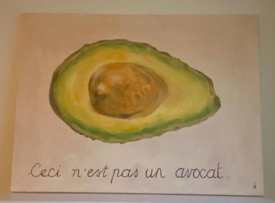 painting on canvas; a huge avocado, cut in half. 
Ceci n'est pas un avocat
