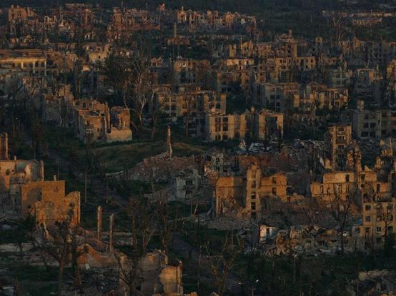 In this aerial view, the ruins of destroyed buildings are seen at dawn in Chasiv Yar, Donetsk Oblast, Ukraine, July 2025