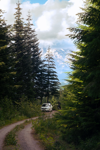 A lonely road overlooking the massive glaciated slopes of Tahoma. Camp in the background.