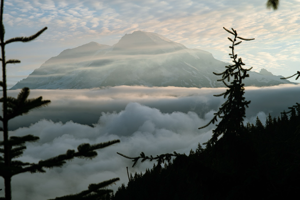 Clouds obscure the snow on the mountain