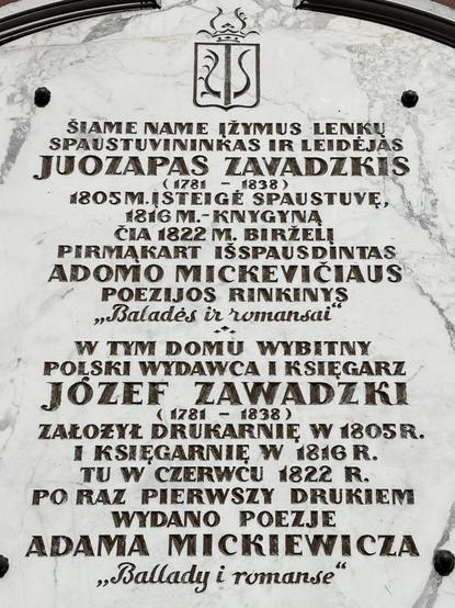 Memorial plaque in Vilnius, stone-carved inscription in Lithuanian and Polish featuring drop-shaped ogoneks.