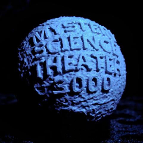 Photo of a 3D printed replica of the Mystery Science Theater 3000 globe from the TV show opening. I shot it using a blue gel on a small light, held up to the camera right for a dramatic look.