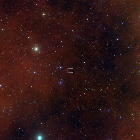 A ground-view 2.5 degree astrophotography image centering the Lynx galaxy cluster filled with countless tiny stars scattered across space.  Near the center of the image, a small white rectangular box marking the outline of the Kitt Peak Mayall 4-m Telescope image that was previously published.