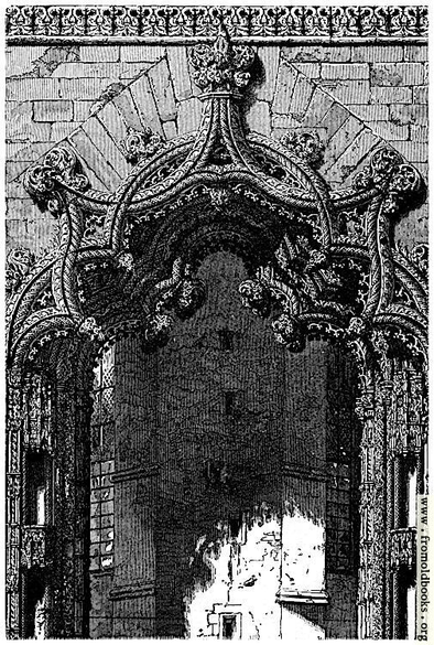 This is a doorway at Batalha Monastery in Potugal, or rather, a portal, as there do not seem to be physical doors that close. It is made of intricately carved stone, with a five-part main arch in which each part is a segment of a circle and is toothed with smaller circles, and the whole then duplicated at slightly smaller sdcale just behind, and and another larger toothed arch, this time in six piees, in front. Either side has niches for statues, or possibly contains invisible angels.